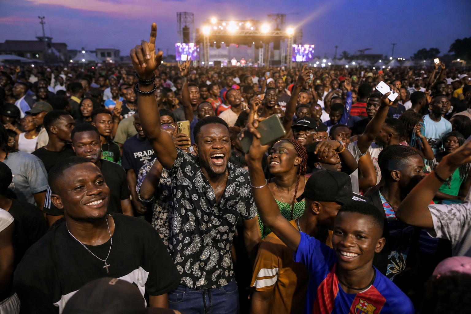 Outdoor concert crowd in Enugu at dusk
